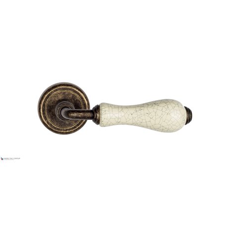 Дверная ручка Venezia "COLOSSEO" белая керамика паутинка D1 античная бронза